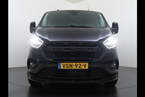 Ford Transit Custom 320 2.0TDCI 170PK Automaat L2H1 Dubbele Cabine 2X Schuifdeur Adap.Cruise 5-Persoons Leder+Verwarmd Trekhaak Navi Camera Pdc Appl Euro 6 Lmv 18" Sidebars Betonplex Vloer Wandbetimmering Lane Assist 3.200KG Trekgewicht