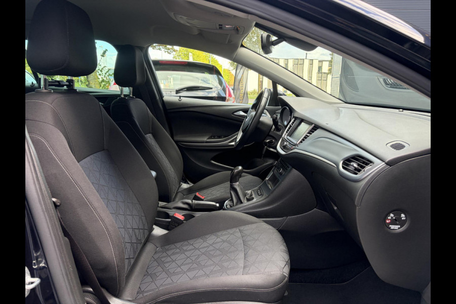Opel Astra Sports Tourer 1.4 Turbo 120 Jaar Edition ✓150pk✓Carplay✓Navi✓Trekhaak✓Pdc V+A✓Clima✓Cruise✓6 Bak✓Lm velgen✓N.A.P✓Apk tot 02-2028