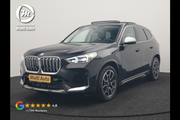 BMW iX1 xDrive30 X Line 67 kWh 313pk Dealer O.H. | Trekhaak Af Fabriek | Panodak | Head Up | Adaptive Cruise | 360 Camera | Harman / Kardon | Lederen Sportstoelen Massage & Memory | Keyless | Sfeerverlichting | Stoelen & Stuur Verwarmd | Apple Carplay | Widescreen Navi | DAB | 19"L.M |