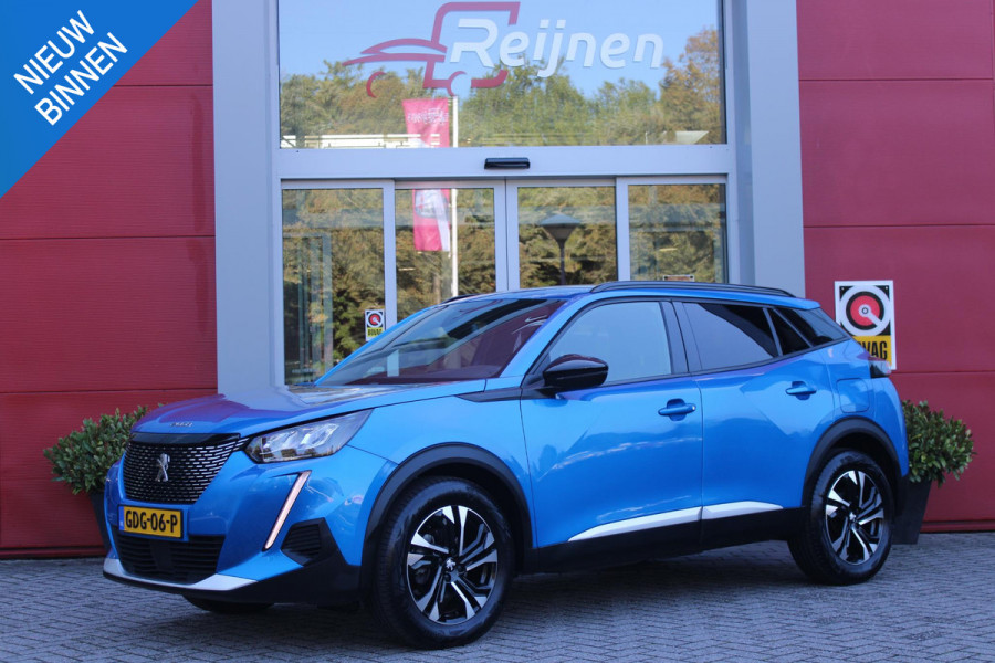 Peugeot 2008 1.2 130PK ALLURE PACK | TREKHAAK AFNEEMBAAR | NAVIGATIE 10" TOUCHSCREEN | APPLE CARPLAY/ANDROID AUTO | ACHTERUITRIJ CAMERA | 3-D INSTRUMENTENPANEEL | CLIMATE CONTROL | CRUISE CONTROL | KEYLESS ENTRY / START | 17" LICHTMETALEN VELGEN |