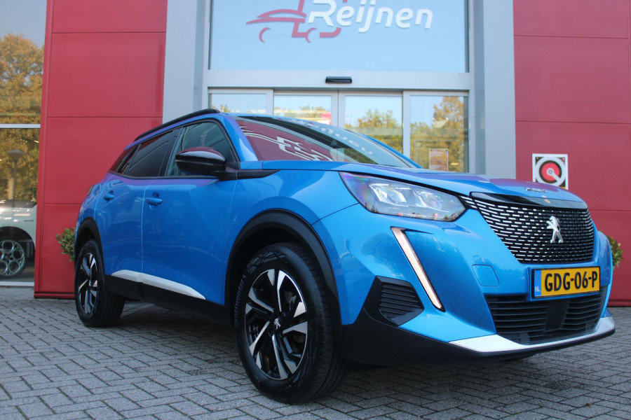 Peugeot 2008 1.2 130PK ALLURE PACK | TREKHAAK AFNEEMBAAR | NAVIGATIE 10" TOUCHSCREEN | APPLE CARPLAY/ANDROID AUTO | ACHTERUITRIJ CAMERA | 3-D INSTRUMENTENPANEEL | CLIMATE CONTROL | CRUISE CONTROL | KEYLESS ENTRY / START | 17" LICHTMETALEN VELGEN |