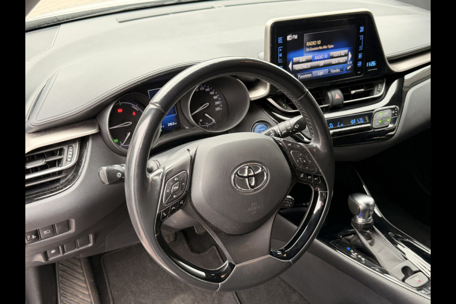 Toyota C-HR 1.8 Hybrid Dynamic | LED | Trekhaak | Camera | Stoelverwarming | All-seasons | Navi | Keyless |