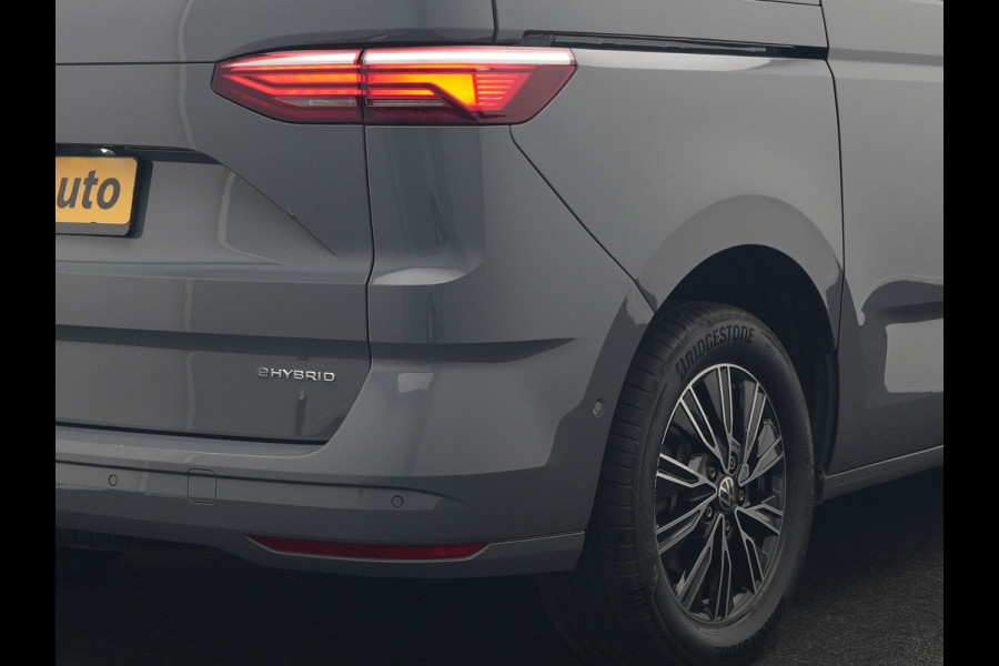 Volkswagen Multivan 1.4 eHybrid Bulli 7 Zits PHEV 218pk Dealer O.H | Trekhaak Af Fabriek | Adaptive Cruise | Camera | Sportstoelen & Stuur Verwarmd | Apple Carplay | BLIS | Navigatie | Virtual | DAB | 17"L.M | Plug In Hybrid |