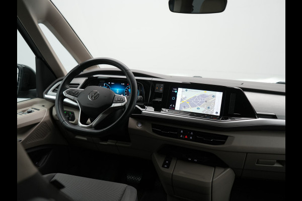 Volkswagen Multivan 1.4 eHybrid Bulli 7 Zits PHEV 218pk Dealer O.H | Trekhaak Af Fabriek | Adaptive Cruise | Camera | Sportstoelen & Stuur Verwarmd | Apple Carplay | BLIS | Navigatie | Virtual | DAB | 17"L.M | Plug In Hybrid |