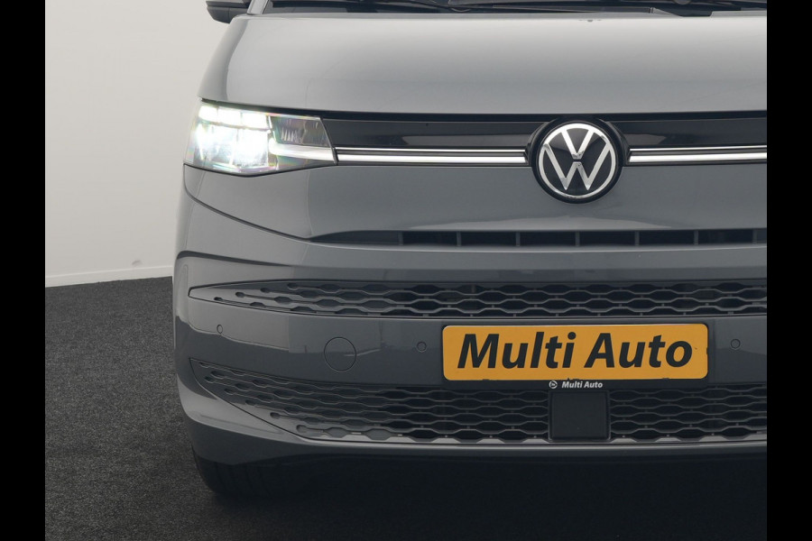 Volkswagen Multivan 1.4 eHybrid Bulli 7 Zits PHEV 218pk Dealer O.H | Trekhaak Af Fabriek | Adaptive Cruise | Camera | Sportstoelen & Stuur Verwarmd | Apple Carplay | BLIS | Navigatie | Virtual | DAB | 17"L.M | Plug In Hybrid |