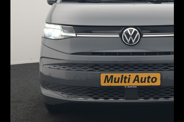 Volkswagen Multivan 1.4 eHybrid Bulli 7 Zits PHEV 218pk Dealer O.H | Trekhaak Af Fabriek | Adaptive Cruise | Camera | Sportstoelen & Stuur Verwarmd | Apple Carplay | BLIS | Navigatie | Virtual | DAB | 17"L.M | Plug In Hybrid |