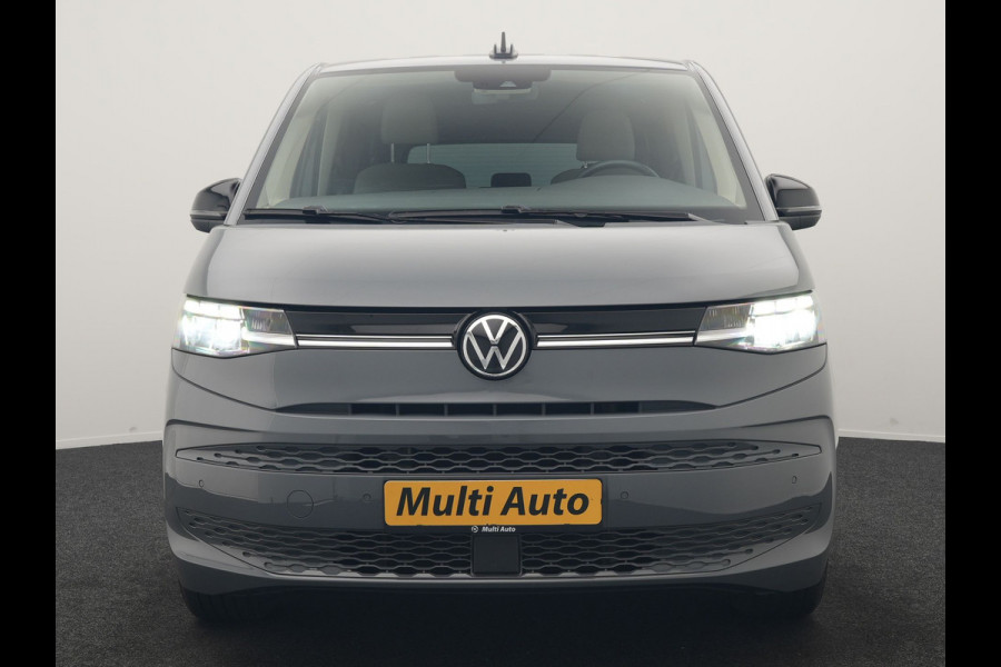 Volkswagen Multivan 1.4 eHybrid Bulli 7 Zits PHEV 218pk Dealer O.H | Trekhaak Af Fabriek | Adaptive Cruise | Camera | Sportstoelen & Stuur Verwarmd | Apple Carplay | BLIS | Navigatie | Virtual | DAB | 17"L.M | Plug In Hybrid |