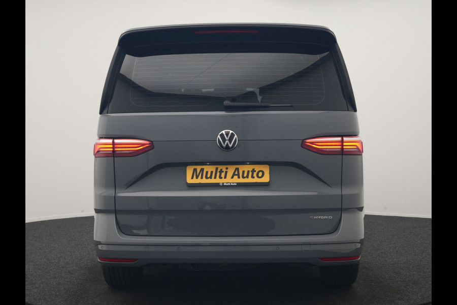 Volkswagen Multivan 1.4 eHybrid Bulli 7 Zits PHEV 218pk Dealer O.H | Trekhaak Af Fabriek | Adaptive Cruise | Camera | Sportstoelen & Stuur Verwarmd | Apple Carplay | BLIS | Navigatie | Virtual | DAB | 17"L.M | Plug In Hybrid |