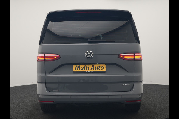 Volkswagen Multivan 1.4 eHybrid Bulli 7 Zits PHEV 218pk Dealer O.H | Trekhaak Af Fabriek | Adaptive Cruise | Camera | Sportstoelen & Stuur Verwarmd | Apple Carplay | BLIS | Navigatie | Virtual | DAB | 17"L.M | Plug In Hybrid |