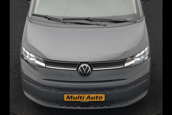 Volkswagen Multivan 1.4 eHybrid Bulli 7 Zits PHEV 218pk Dealer O.H | Trekhaak Af Fabriek | Adaptive Cruise | Camera | Sportstoelen & Stuur Verwarmd | Apple Carplay | BLIS | Navigatie | Virtual | DAB | 17"L.M | Plug In Hybrid |