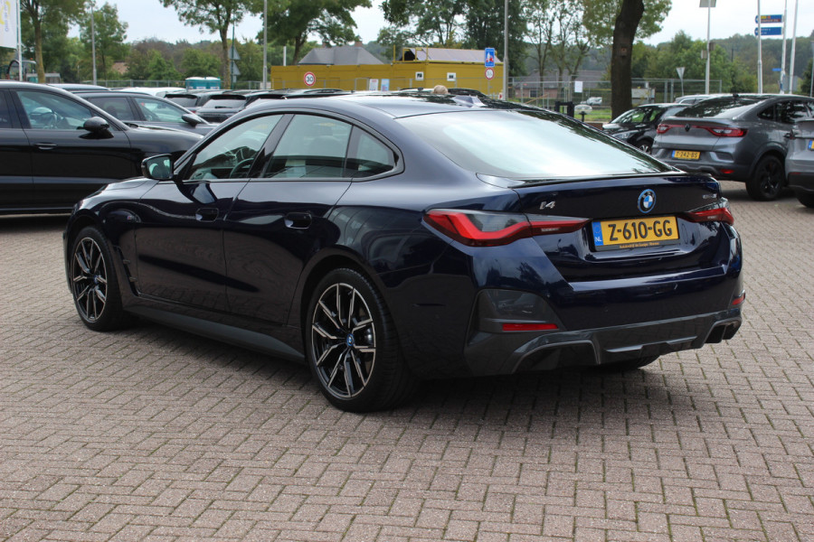 BMW i4 eDrive35 High Executive 70 kWh / SoH 97,5% / 14.818 km / Trekhaak / Schuifdak / 360Camera / Head-up / Harman Kardon / Leder / 19'' / Keyless / Sfeerverlichting / Stuur+Stoelverwarming / Dodehoek / DAB / ACC