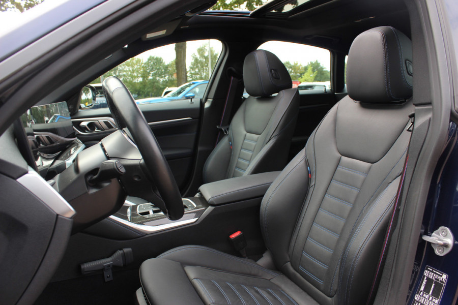 BMW i4 eDrive35 High Executive 70 kWh / SoH 97,5% / 14.818 km / Trekhaak / Schuifdak / 360Camera / Head-up / Harman Kardon / Leder / 19'' / Keyless / Sfeerverlichting / Stuur+Stoelverwarming / Dodehoek / DAB / ACC