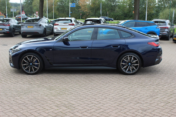 BMW i4 eDrive35 High Executive 70 kWh / SoH 97,5% / 14.818 km / Trekhaak / Schuifdak / 360Camera / Head-up / Harman Kardon / Leder / 19'' / Keyless / Sfeerverlichting / Stuur+Stoelverwarming / Dodehoek / DAB / ACC