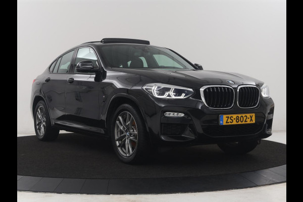 BMW X4 xDrive20i High Executive Edition M-sport | Panoramadak | Leder | Trekhaak | Camera | Sfeerverlichting | Stoelverwarming | Full LED | Climate control | Park assist | Cruise control |