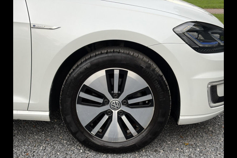 Volkswagen e-Golf e-Golf ✓SOH 85,18 %✓2e Eigenaar✓Carplay✓Navi✓Clima✓Cruise✓Pdc V+A✓136pk✓Lm velgen✓Bj 12-2018✓N.A.P✓Apk tot 10-2027