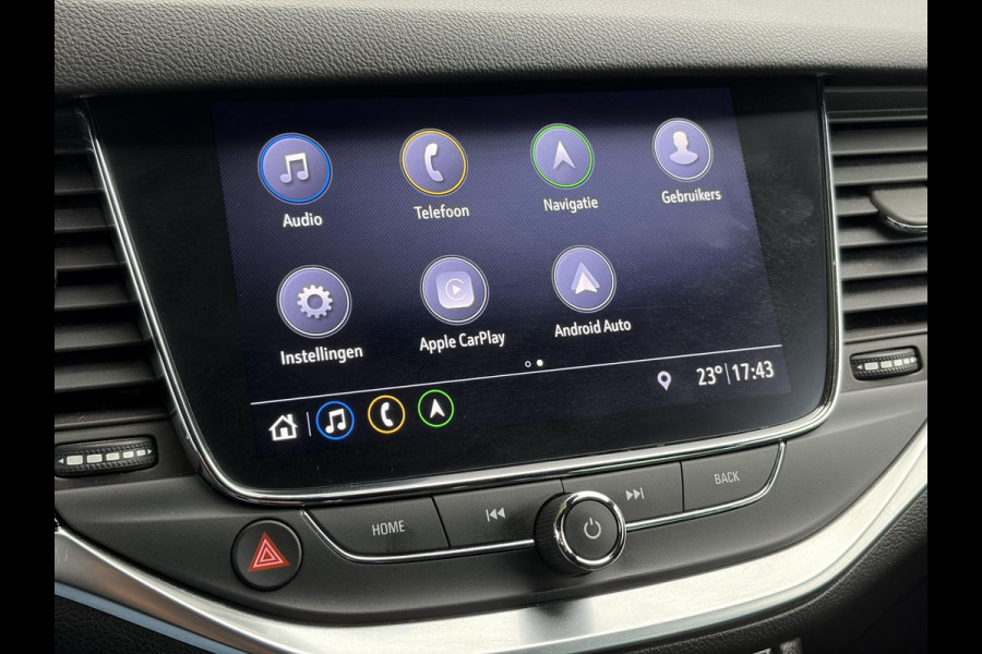 Opel Astra Sports Tourer 1.2 Elegance ✓110pk✓Camera✓Carplay✓Navi✓Halfleder✓Keyless✓Trekhaak✓Pdc V+A✓Clima✓Cruise✓Elekt Stoel✓Recent beurt gehad✓Dodehoeksensor✓Rijstrooksensor✓Lm velgen✓N.A.P✓Apk tot 11-2027