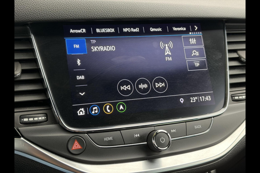 Opel Astra Sports Tourer 1.2 Elegance ✓110pk✓Camera✓Carplay✓Navi✓Halfleder✓Keyless✓Trekhaak✓Pdc V+A✓Clima✓Cruise✓Elekt Stoel✓Recent beurt gehad✓Dodehoeksensor✓Rijstrooksensor✓Lm velgen✓N.A.P✓Apk tot 11-2027