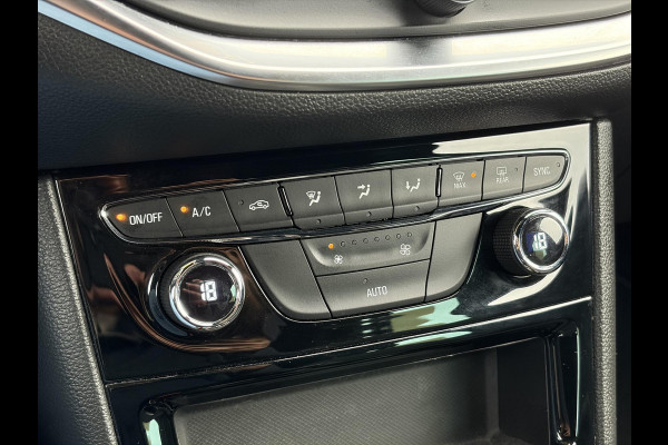 Opel Astra Sports Tourer 1.2 Elegance ✓110pk✓Camera✓Carplay✓Navi✓Halfleder✓Keyless✓Trekhaak✓Pdc V+A✓Clima✓Cruise✓Elekt Stoel✓Recent beurt gehad✓Dodehoeksensor✓Rijstrooksensor✓Lm velgen✓N.A.P✓Apk tot 11-2027
