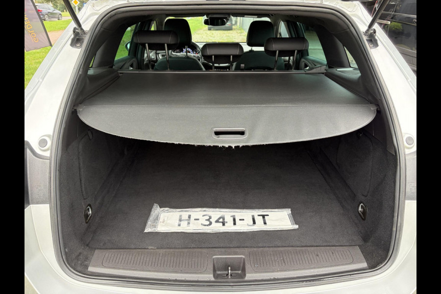 Opel Astra Sports Tourer 1.2 Elegance ✓110pk✓Camera✓Carplay✓Navi✓Halfleder✓Keyless✓Trekhaak✓Pdc V+A✓Clima✓Cruise✓Elekt Stoel✓Recent beurt gehad✓Dodehoeksensor✓Rijstrooksensor✓Lm velgen✓N.A.P✓Apk tot 11-2027