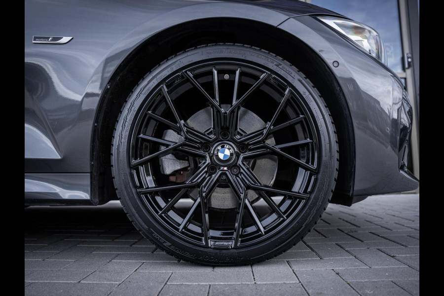 BMW 3 Serie Touring 320e High Executive M-Sport l Pano l ACC | Trekhaak l 360cam l ACC