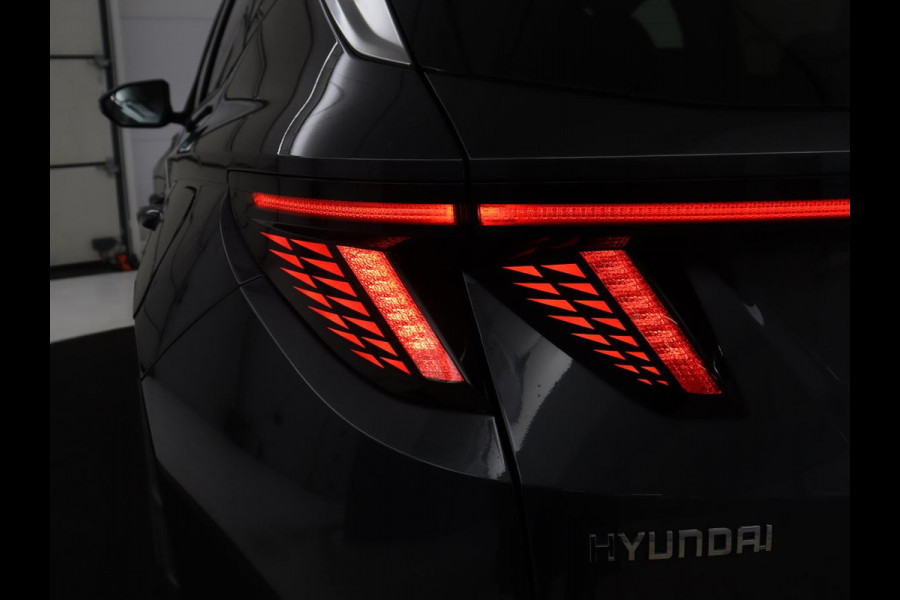 Hyundai Tucson 1.6 T-GDI HEV Premium | Leder | Stoelkoeling | Trekhaak | 360 camera | Adaptive cruise | Carplay | Krell Sound | Memory | Stuur/stoelverwarming |