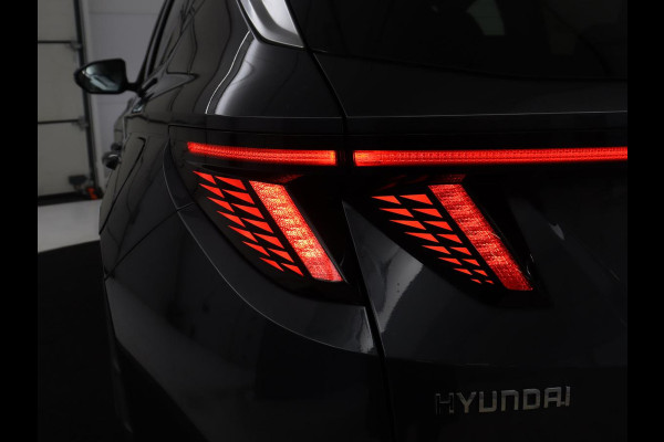 Hyundai Tucson 1.6 T-GDI HEV Premium | Leder | Stoelkoeling | Trekhaak | 360 camera | Adaptive cruise | Carplay | Krell Sound | Memory | Stuur/stoelverwarming |