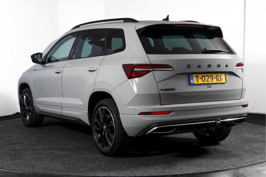 Škoda Karoq 1.5 TSI ACT 150 PK Sportline Business | Afn. Trekhaak | Dig. Cockpit | Adapt. Cruise | Stoel-+Stuurverw. | Matrix LED | Camera | NAV+App. Connect | ECC | Elek. Klep | LM 18" |