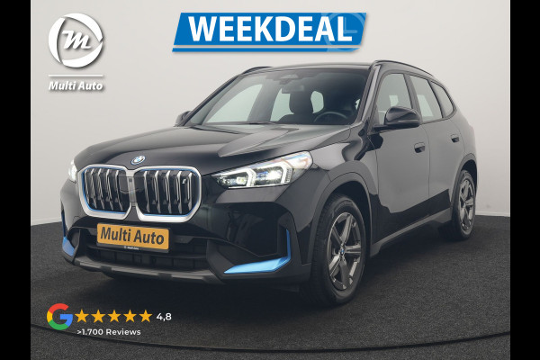 BMW iX1 xDrive30 67 kWh 313pk Dealer O.H. | Trekhaak Af Fabriek | Camera | Adaptief M Onderstel | Voorstoelen Verwarmd | Blis | Keyless | Apple Carplay | Adaptive LED | Sfeerverlichting | Widescreen Navi | DAB |