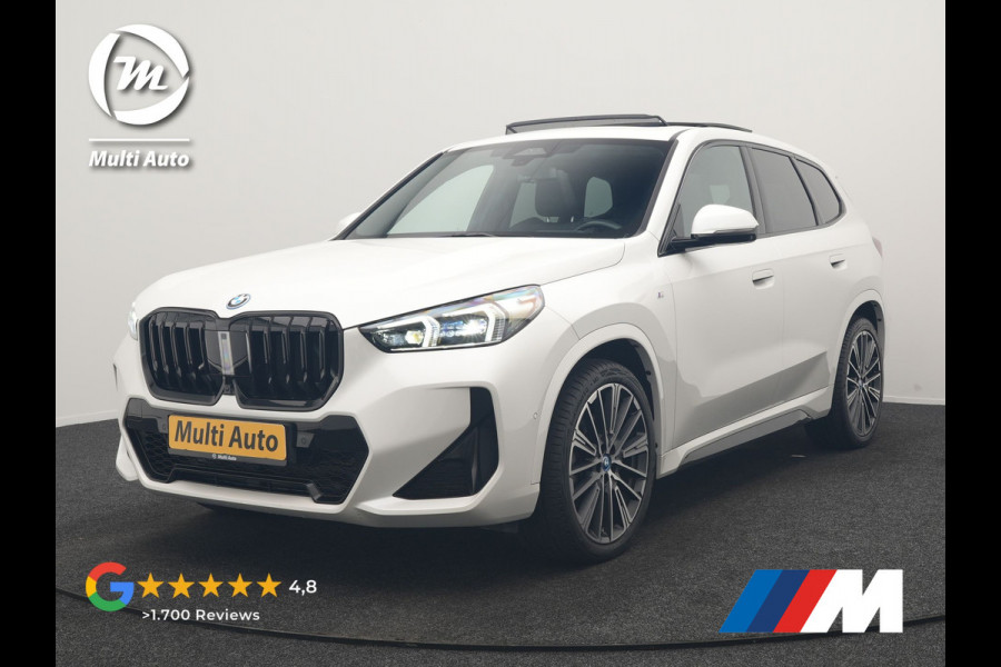 BMW iX1 xDrive30 M Sport 313pk Dealer O.H. | Trekhaak Af Fabriek | Panodak | 360 Camera | Head Up | Lederen Sportstoelen Memory & Verwarmd | Stuur Verwarmd | Keyless | BLIS | Sfeerverlichting | Apple Carplay | Navigatie | DAB | 20"L.M