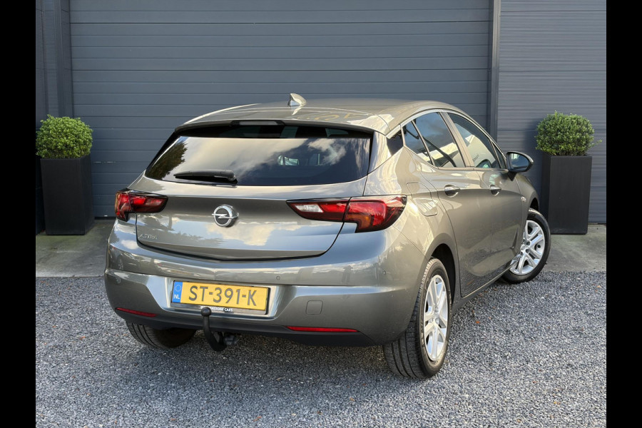 Opel Astra 1.0 Online Edition ✓2e Eigenaar✓Trekhaak✓Carplay✓Dealer Onderhouden✓Navi✓105pk✓Pdc V+A✓Clima✓Cruise✓Lm velgen✓N.A.P✓Apk tot 05-2027