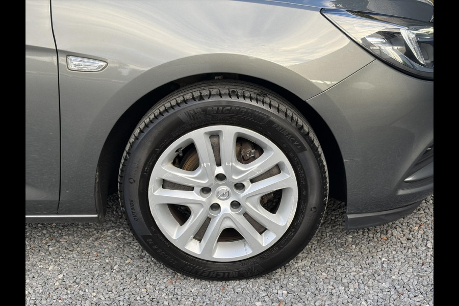 Opel Astra 1.0 Online Edition ✓2e Eigenaar✓Trekhaak✓Carplay✓Dealer Onderhouden✓Navi✓105pk✓Pdc V+A✓Clima✓Cruise✓Lm velgen✓N.A.P✓Apk tot 05-2027