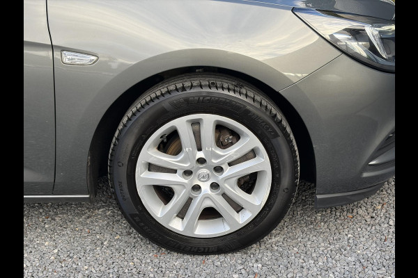 Opel Astra 1.0 Online Edition ✓2e Eigenaar✓Trekhaak✓Carplay✓Dealer Onderhouden✓Navi✓105pk✓Pdc V+A✓Clima✓Cruise✓Lm velgen✓N.A.P✓Apk tot 05-2027