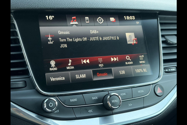 Opel Astra Sports Tourer 1.4 Innovation ✓Trekhaak✓Camera✓Carplay✓Navi✓Recent beurt gehad✓150pk✓Keyless✓Halfleder✓6 Bak✓Rijstrooksensor✓Dodehoeksensor✓Pdc V+A✓Lm velgen✓Clima✓Cruise✓N.A.P✓Apk tot 09-2027