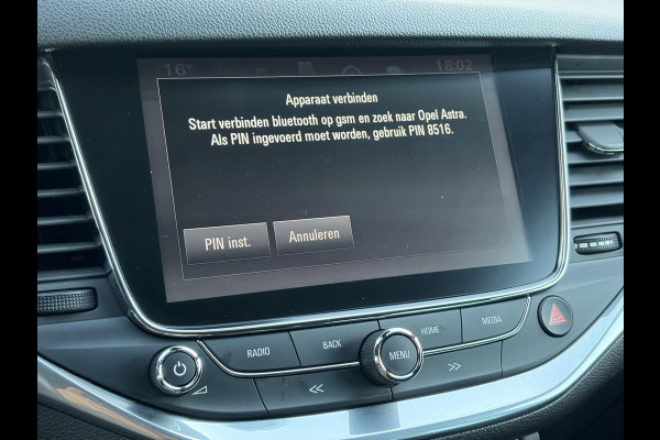 Opel Astra Sports Tourer 1.4 Innovation ✓Trekhaak✓Camera✓Carplay✓Navi✓Recent beurt gehad✓150pk✓Keyless✓Halfleder✓6 Bak✓Rijstrooksensor✓Dodehoeksensor✓Pdc V+A✓Lm velgen✓Clima✓Cruise✓N.A.P✓Apk tot 09-2027