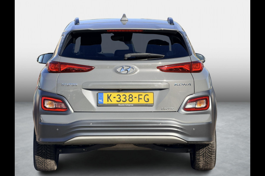 Hyundai Kona EV Fashion 39 kWh SoH 89.9% | 3 Fase | Warmtepomp | Fabrieksgarantie | Camera | Navigatie | Adaptieve Cruise | Dealeronderhouden |