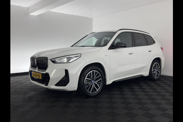 BMW iX1 xDrive30 M-Styling Launch Edition 67 kWh (3-Fase-11kW) {SoH-99%) (INCL.BTW) *LEATHER-MICROFIBRE | FULL-LED | HARMAN/KARDON | WIDESCREEN-DIGI-COCKPIT | CAMERA | PRIVACY-GLASS | SHIFT-PADDLES | SPORT-SEATS | NAVI-FULLMAP | DAB+ | 18''ALU | TOWBAR*