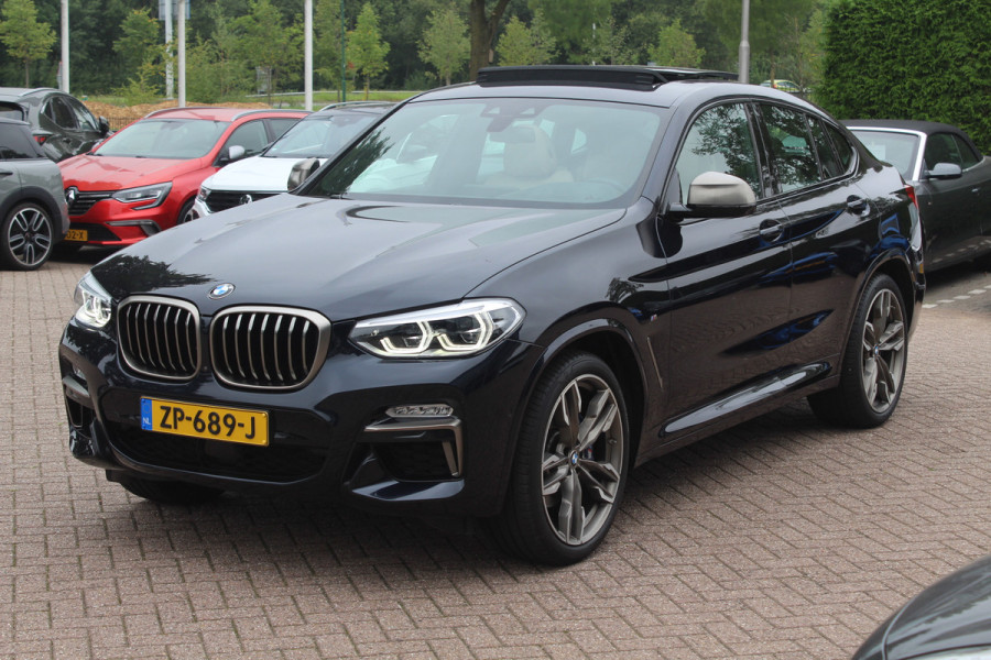 BMW X4 M40i High Exe. M Sport 73.952 km NL Auto. / Trekhaak / Panoramadak / Camera / Head-up / Luxe Leder / 21'' / Harman Kardon / Navigatie / Stuur+Stoelverwarming / DAB / Dodehoek / Cruise Control