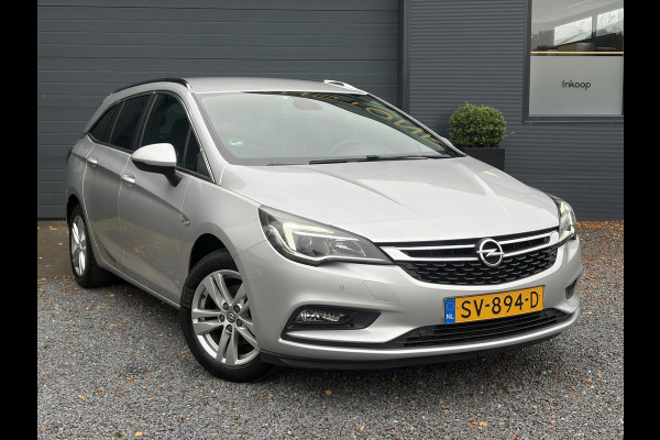 Opel Astra Sports Tourer 1.4 Online Edition ✓2e Eigenaar✓Trekhaak✓Carplay✓Navi✓Recent beurt gehad✓150pk✓Dealer Onderhouden✓6 Bak✓Pdc V+A✓Lm velgen✓Clima✓Cruise✓N.A.P✓Apk tot 06-2027