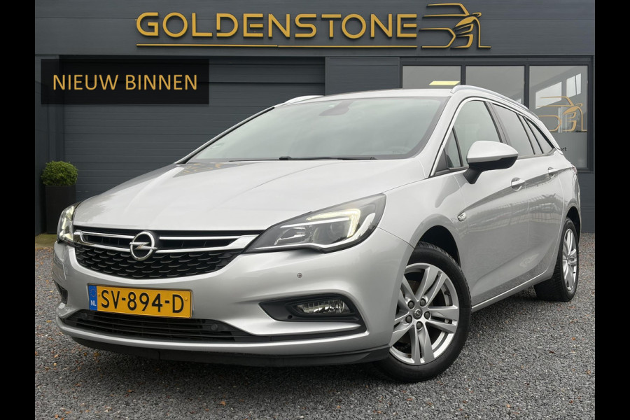 Opel Astra Sports Tourer 1.4 Online Edition ✓2e Eigenaar✓Trekhaak✓Carplay✓Navi✓Recent beurt gehad✓150pk✓Dealer Onderhouden✓6 Bak✓Pdc V+A✓Lm velgen✓Clima✓Cruise✓N.A.P✓Apk tot 06-2027