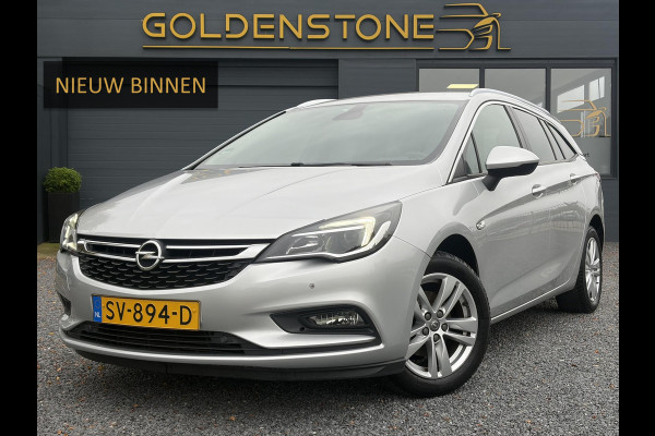 Opel Astra Sports Tourer 1.4 Online Edition ✓2e Eigenaar✓Trekhaak✓Carplay✓Navi✓Recent beurt gehad✓150pk✓Dealer Onderhouden✓6 Bak✓Pdc V+A✓Lm velgen✓Clima✓Cruise✓N.A.P✓Apk tot 06-2027