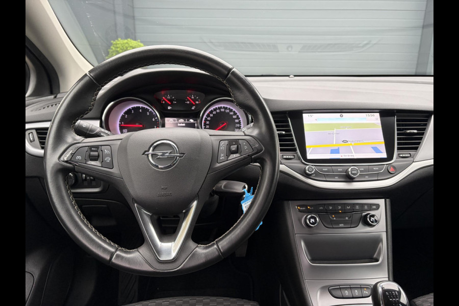 Opel Astra Sports Tourer 1.4 Online Edition ✓2e Eigenaar✓Trekhaak✓Carplay✓Navi✓Recent beurt gehad✓150pk✓Dealer Onderhouden✓6 Bak✓Pdc V+A✓Lm velgen✓Clima✓Cruise✓N.A.P✓Apk tot 06-2027