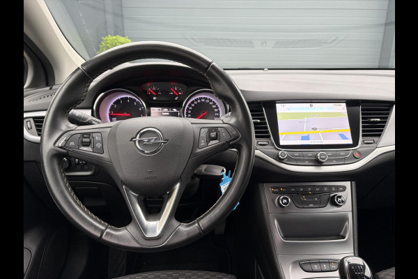 Opel Astra Sports Tourer 1.4 Online Edition ✓2e Eigenaar✓Trekhaak✓Carplay✓Navi✓Recent beurt gehad✓150pk✓Dealer Onderhouden✓6 Bak✓Pdc V+A✓Lm velgen✓Clima✓Cruise✓N.A.P✓Apk tot 06-2027