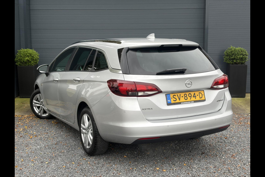 Opel Astra Sports Tourer 1.4 Online Edition ✓2e Eigenaar✓Trekhaak✓Carplay✓Navi✓Recent beurt gehad✓150pk✓Dealer Onderhouden✓6 Bak✓Pdc V+A✓Lm velgen✓Clima✓Cruise✓N.A.P✓Apk tot 06-2027
