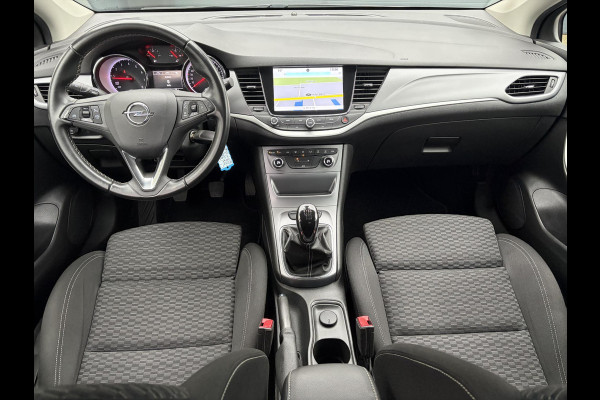 Opel Astra Sports Tourer 1.4 Online Edition ✓2e Eigenaar✓Trekhaak✓Carplay✓Navi✓Recent beurt gehad✓150pk✓Dealer Onderhouden✓6 Bak✓Pdc V+A✓Lm velgen✓Clima✓Cruise✓N.A.P✓Apk tot 06-2027