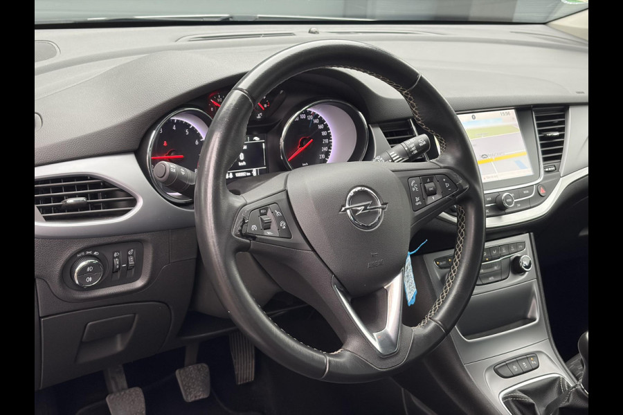 Opel Astra Sports Tourer 1.4 Online Edition ✓2e Eigenaar✓Trekhaak✓Carplay✓Navi✓Recent beurt gehad✓150pk✓Dealer Onderhouden✓6 Bak✓Pdc V+A✓Lm velgen✓Clima✓Cruise✓N.A.P✓Apk tot 06-2027