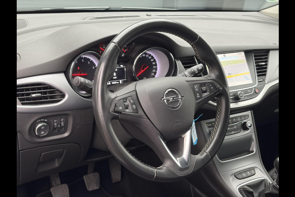Opel Astra Sports Tourer 1.4 Online Edition ✓2e Eigenaar✓Trekhaak✓Carplay✓Navi✓Recent beurt gehad✓150pk✓Dealer Onderhouden✓6 Bak✓Pdc V+A✓Lm velgen✓Clima✓Cruise✓N.A.P✓Apk tot 06-2027