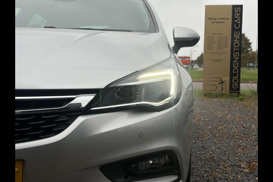 Opel Astra Sports Tourer 1.4 Online Edition ✓2e Eigenaar✓Trekhaak✓Carplay✓Navi✓Recent beurt gehad✓150pk✓Dealer Onderhouden✓6 Bak✓Pdc V+A✓Lm velgen✓Clima✓Cruise✓N.A.P✓Apk tot 06-2027